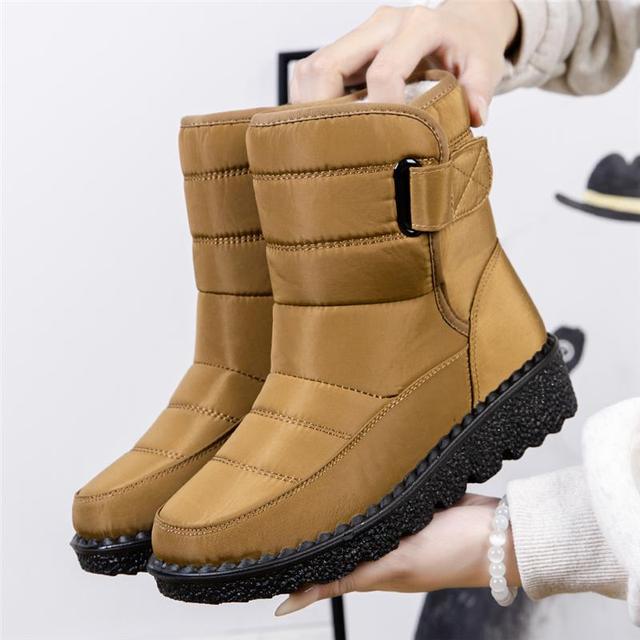 Women's snow boots for extreme cold, waterproof, warm, padded, & non-slip for safety.
