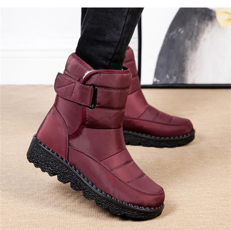 Non-slip women's waterproof winter boots, warm and padded for secure footing in snow & ice.