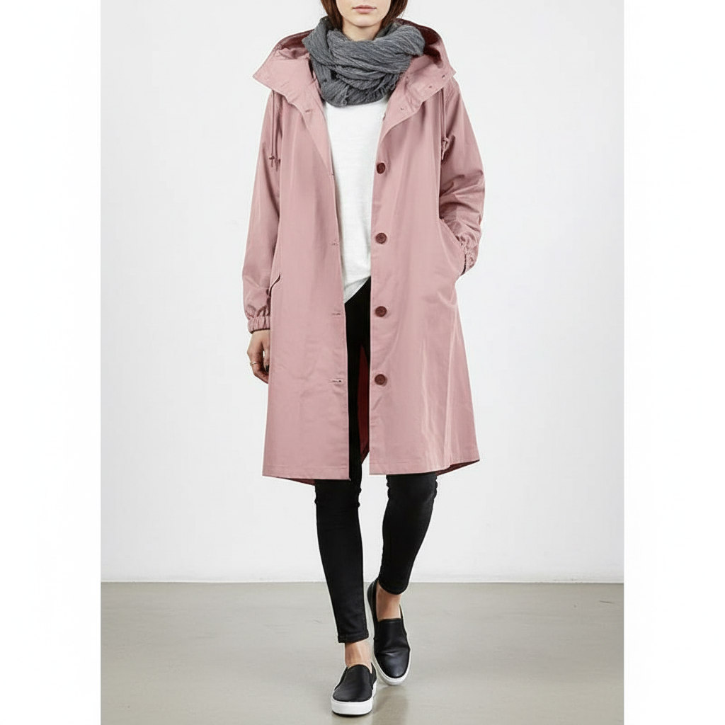 Lightweight hooded women's rain jacket, perfect for travel & all-weather outdoor protection.