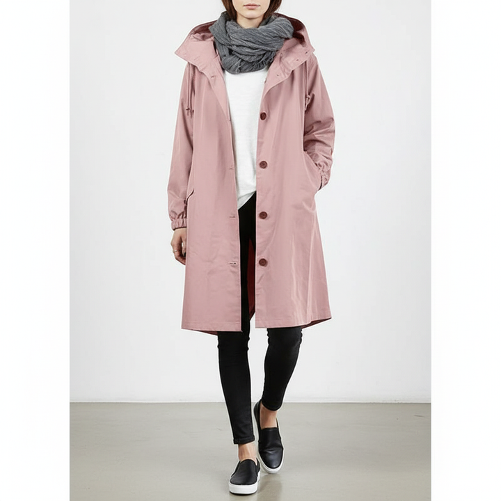 Lightweight hooded women's rain jacket, perfect for travel & all-weather outdoor protection.