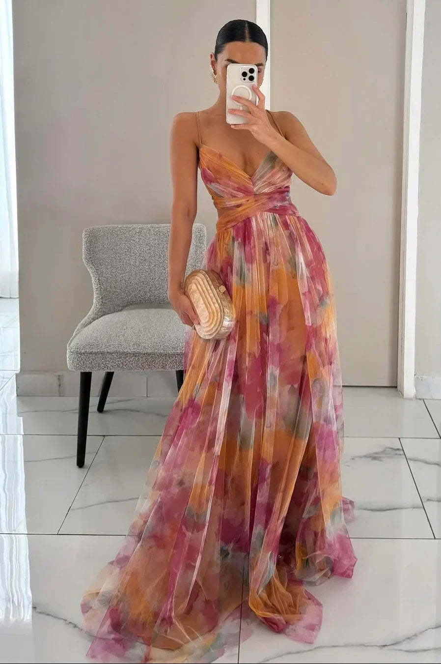 Women's watercolor floral maxi dress with elegant twist-front detail, perfect for summer occasions.