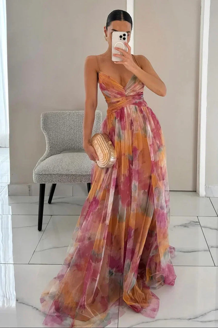 Women's watercolor floral maxi dress with elegant twist-front detail, perfect for summer occasions.