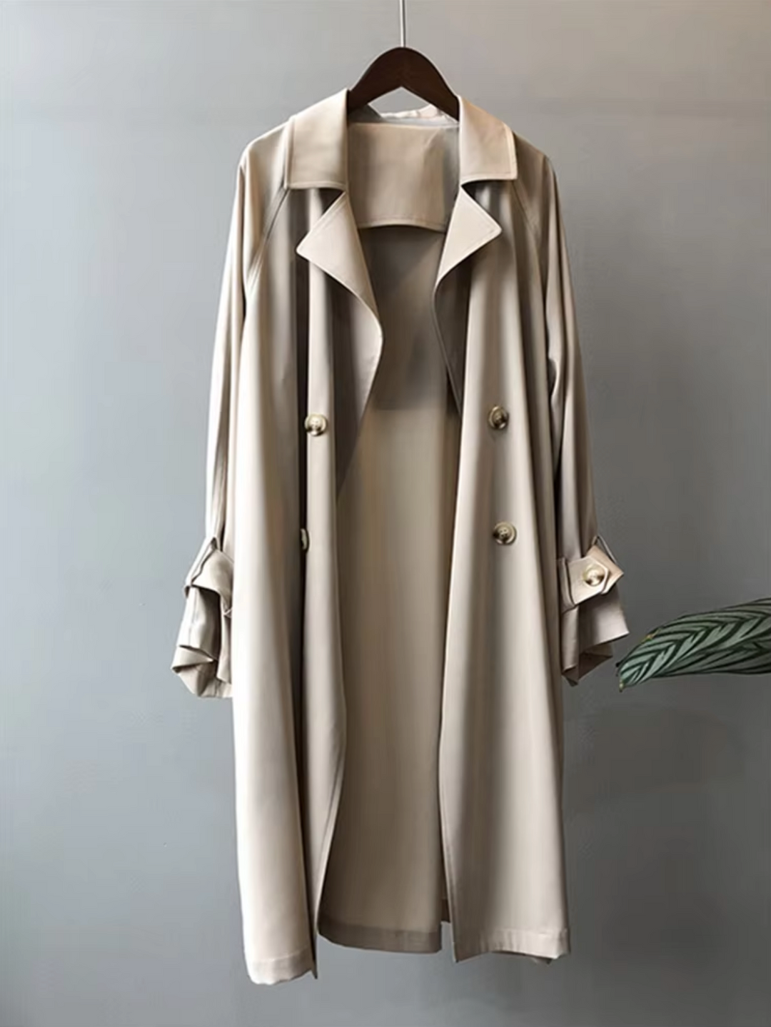 Versatile women's double-breasted trench coat. Waterproof, elegant outerwear perfect for spring and fall casual or formal wear.