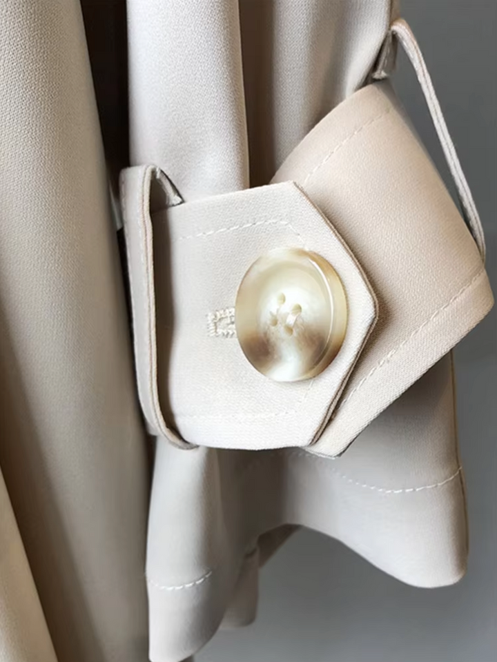 Stylish women's waterproof double-breasted trench coat. A classic, versatile lapel coat for all-weather protection in spring/fall.