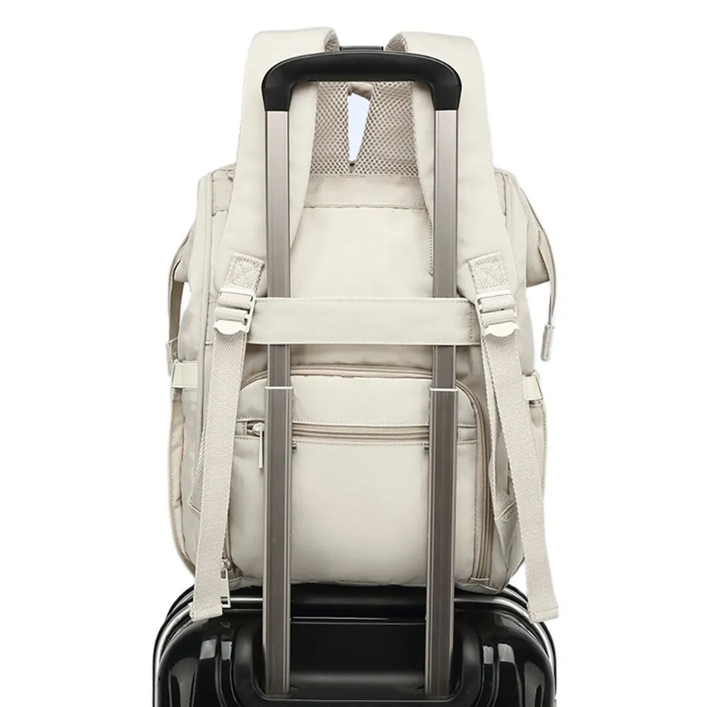 Side profile of a travel diaper bag, showcasing its spacious design for parenting gear.