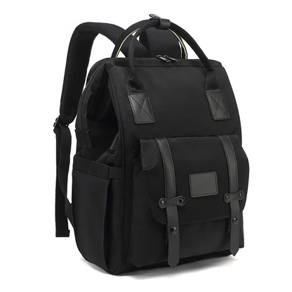Diaper backpack with insulated bottle pockets, essential for new moms on the go.