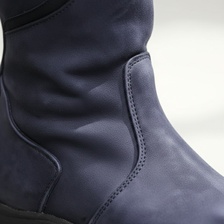 Stylish black waterproof women's boots, knee-high with a round toe and adjustable calf.
