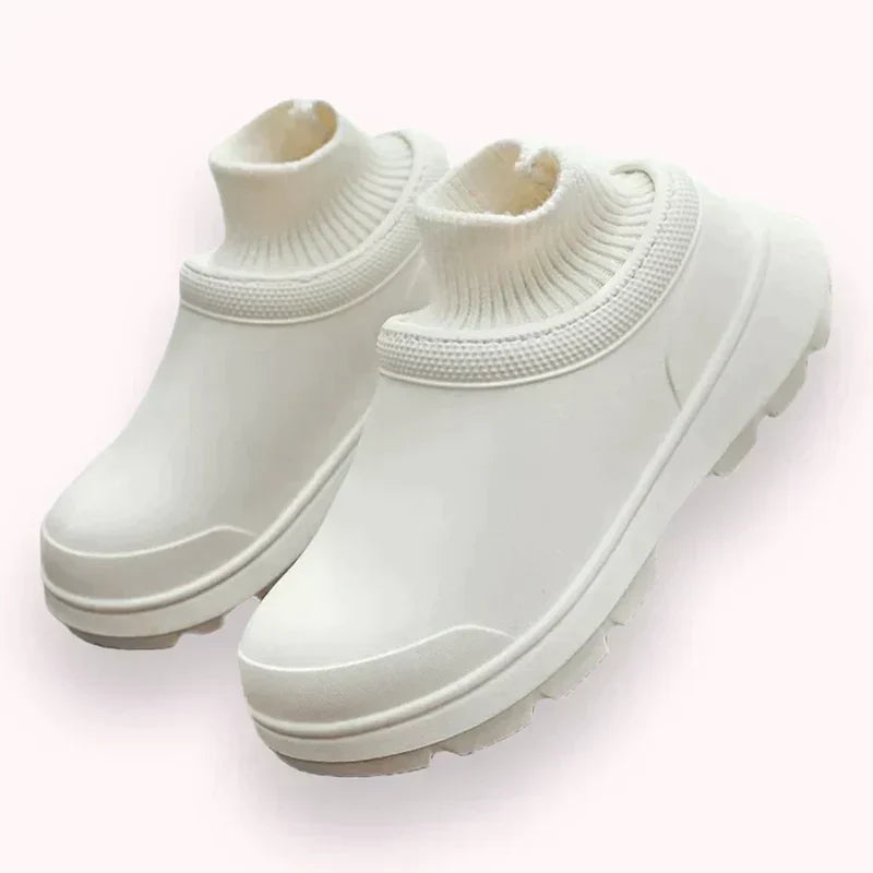 Women's waterproof slip-on clog with knit ankle cuff, ideal for casual outdoor wear & comfort.