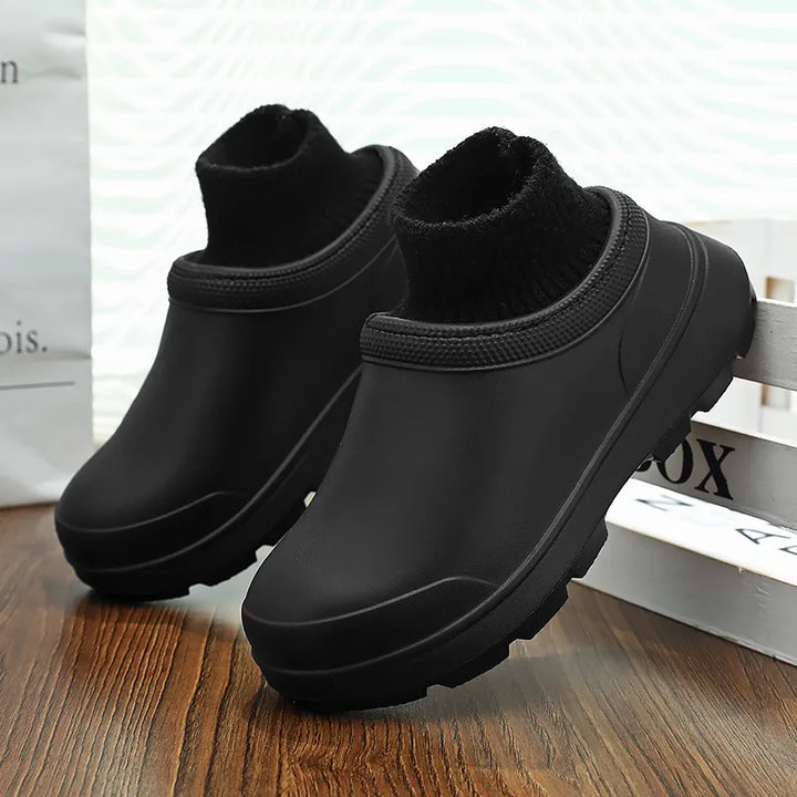 Durable women's waterproof slip-on clogs, featuring a supportive sole & soft knit ankle cuff for lasting comfort.