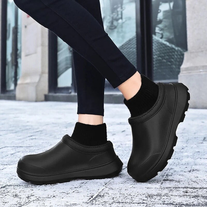 Durable women's waterproof slip-on clogs, non-slip sole & knit ankle cuff for secure, comfortable walking.