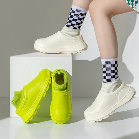 Easy-on women's waterproof slip-on clogs featuring a comfy knit ankle cuff for quick, casual outdoor wear.
