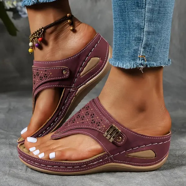 Comfort fit women's wedge sandals. Adjustable straps and stylish cut-out design make them perfect summer footwear.
