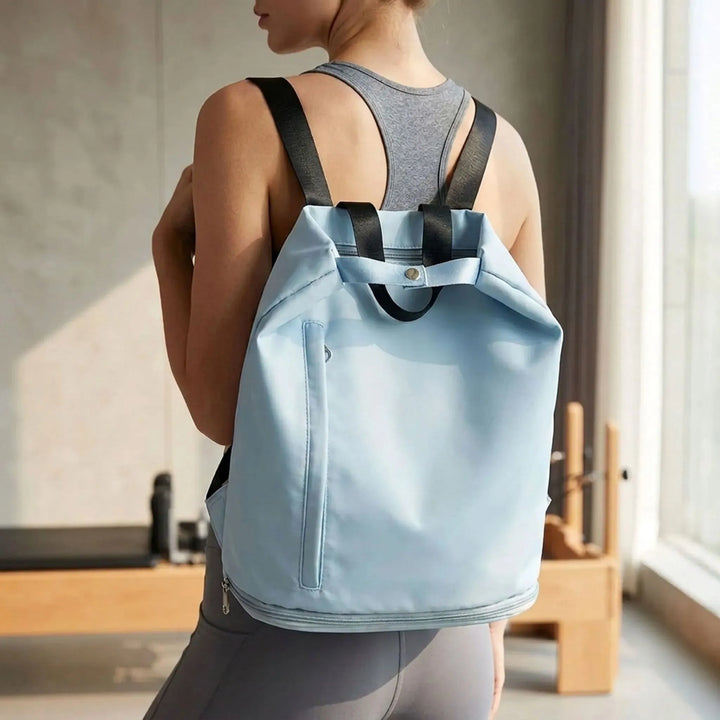 Women's wet dry sports backpack for gym & travel. Durable polyester bag with separate compartments for fitness gear.
