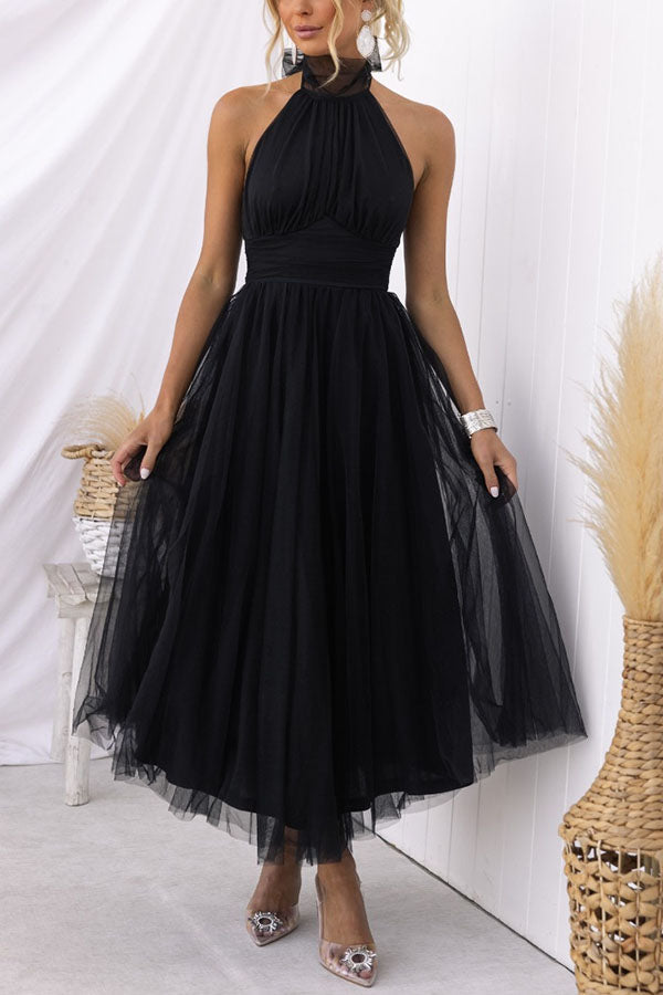 Graceful whimsical tulle party dress for women, designed for elegant wedding guests & evening events.