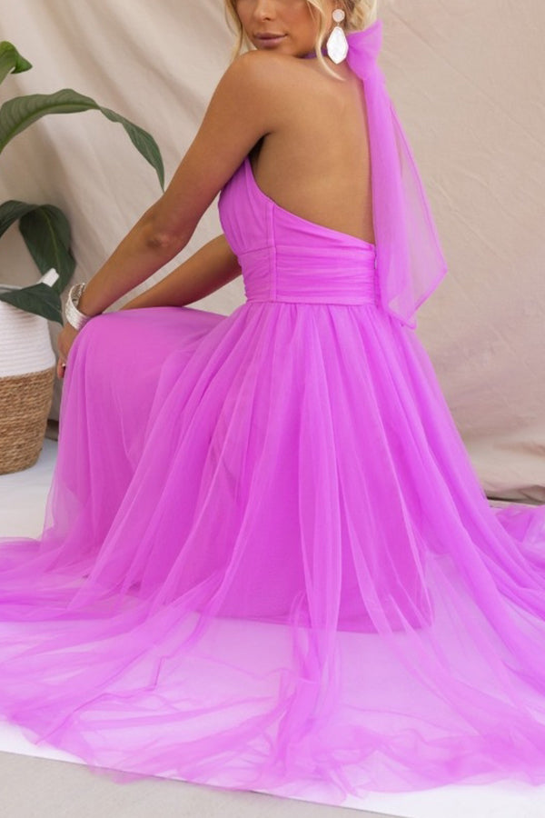 Layers of soft, colorful whimsical tulle fabric on an elegant women's party dress. Ideal for formal events.