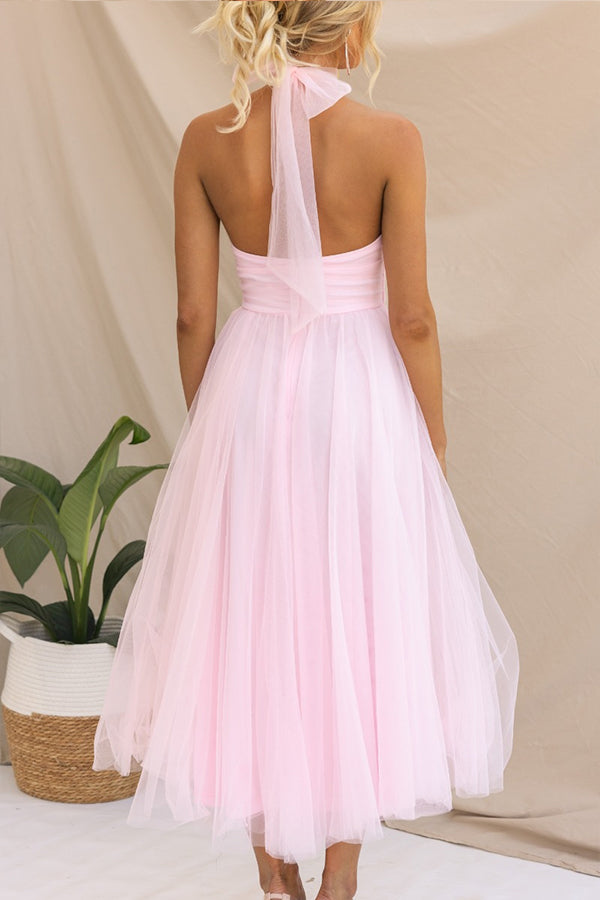 Whimsical tulle party dress flowing gracefully, a colorful & elegant choice for women's special occasions.