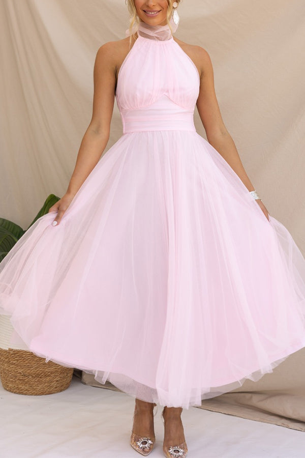 Close-up of the delicate, soft tulle fabric and elegant design of a women's whimsical party dress.