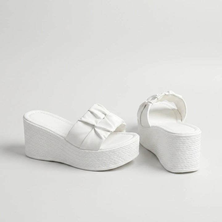Stylish women's slip-on platform wedge sandals with an open toe & unique ruched strap for summer comfort.