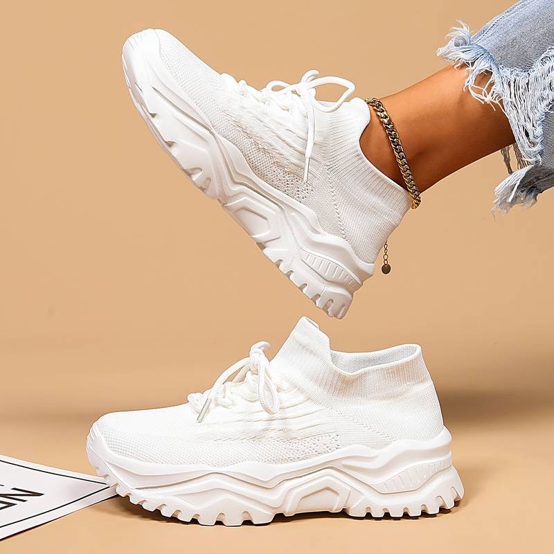 Stylish women's lace-up sneakers with a modern chunky sole for versatile casual outfits & comfort.