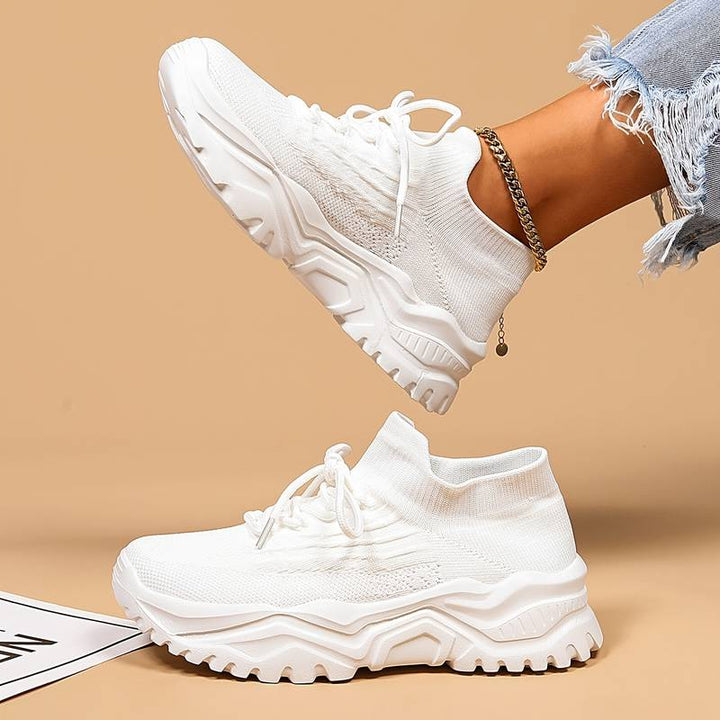 Stylish women's lace-up sneakers with a modern chunky sole for versatile casual outfits & comfort.