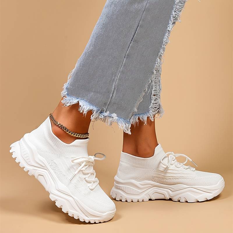 Trendy women's chunky sole lace-up fashion sneakers in a neutral color, ideal for modern casual looks.