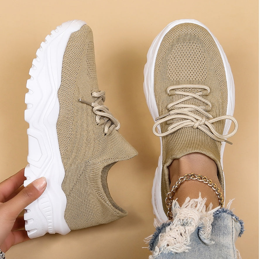 Versatile women's lace-up sneakers with a bold chunky sole, offering modern style for casual outfits.