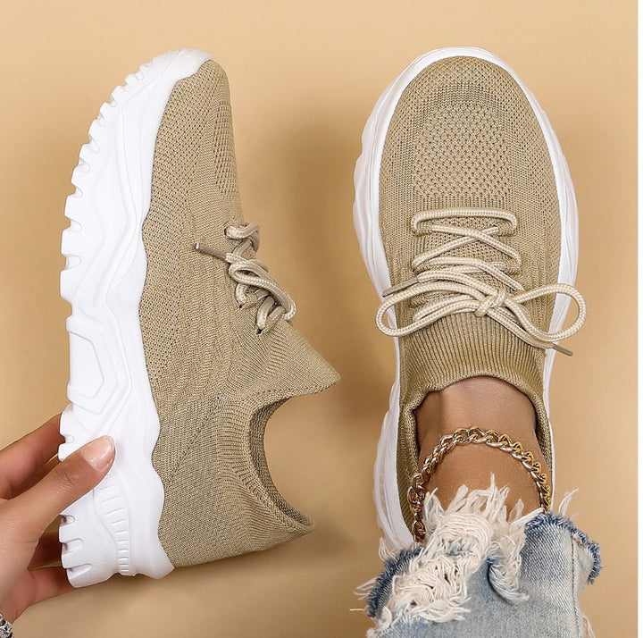 Versatile women's lace-up sneakers with a bold chunky sole, offering modern style for casual outfits.