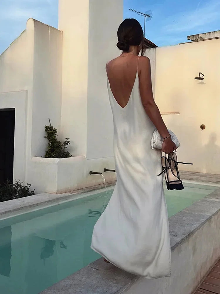 Women's white V-neck ankle-length maxi dress. Comfortable, relaxed fit, stretch fabric for casual everyday wear.