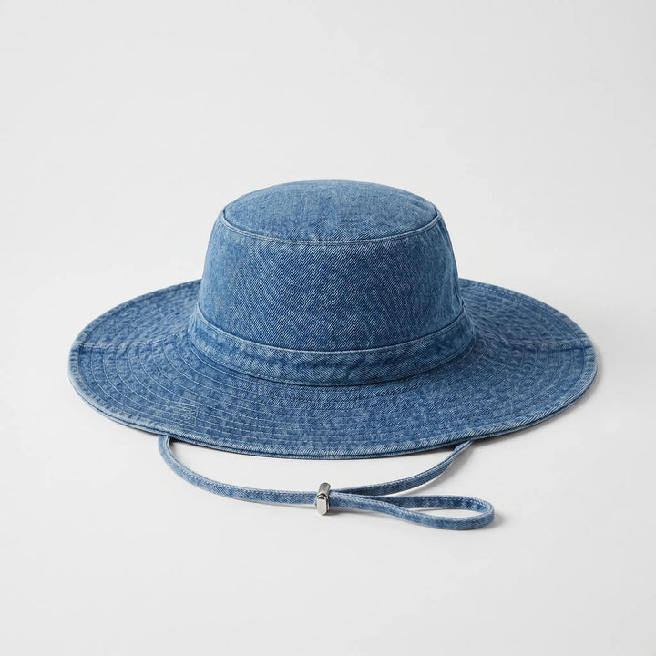 Stylish women's wide brim bucket hat, perfect accessory for travel, beach, & sun protection.