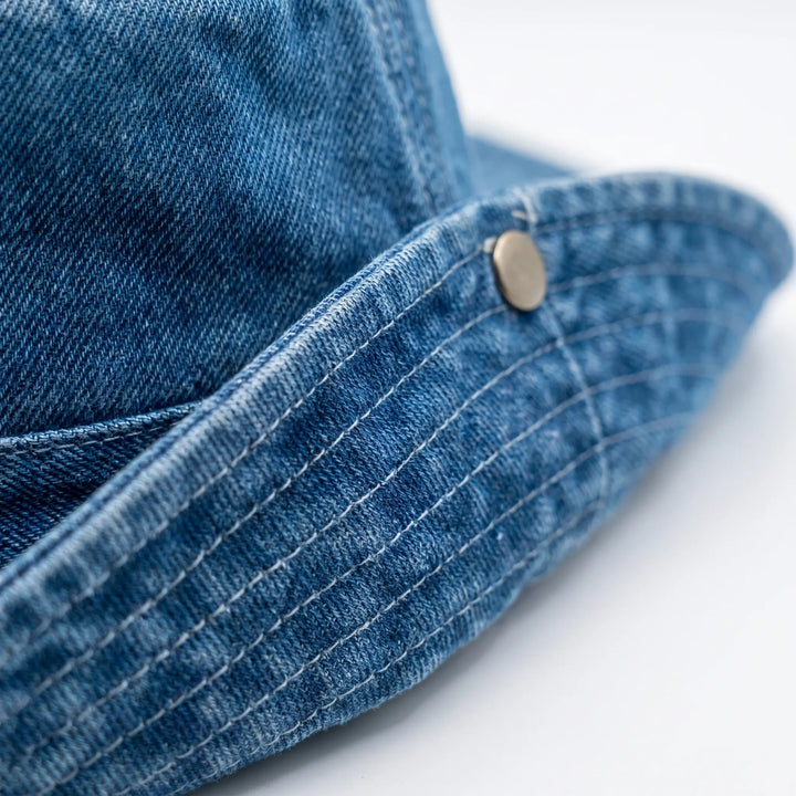 Adjustable wide brim bucket hat for women, offers excellent sun protection & casual summer fashion.
