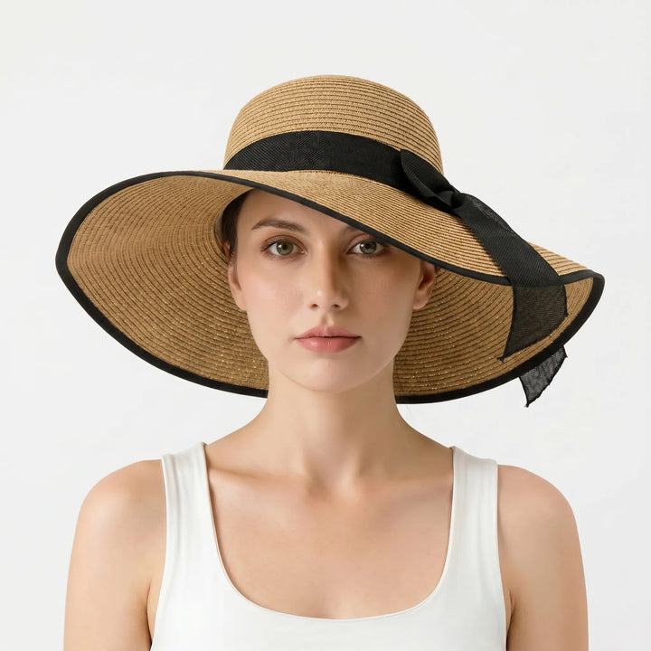 Elegant women's floppy sun hat with wide brim. This versatile packable accessory is perfect for beach or travel.