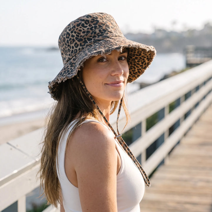 Women's wide brim sun bucket hat for outdoor protection. Perfect for beach, travel, & summer.