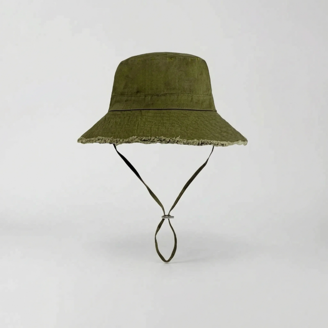 Chic women's wide brim sun hat, blending fashion with practical UV protection for sunny days.