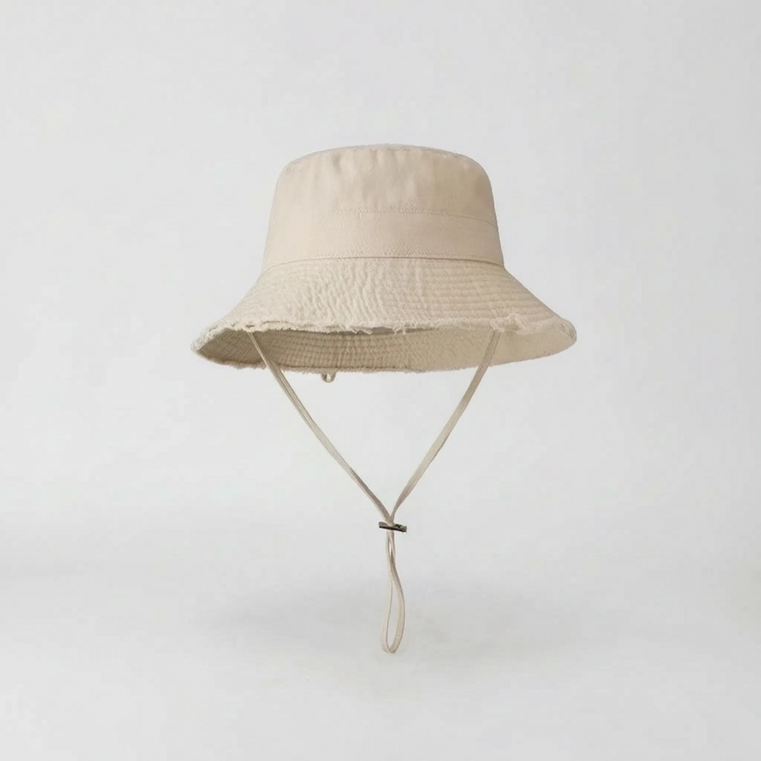 Beach-ready women's wide brim bucket hat, providing essential sun protection for coastal fun.