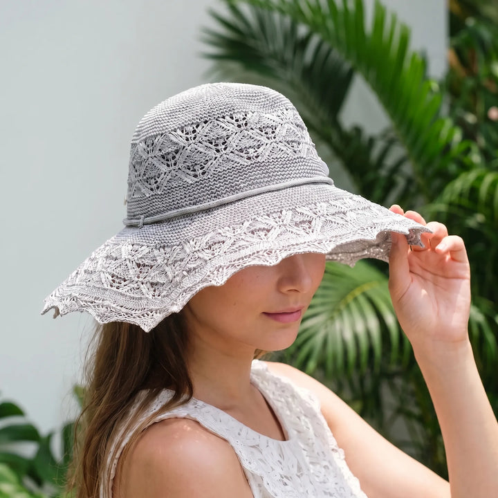 Women's wide brim sun hat for beach & travel. Breathable, packable, perfect summer accessory.