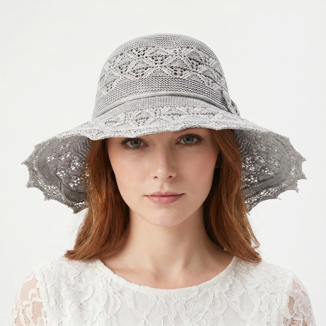 Beige wide brim sun hat for women. Packable & breathable, ideal for beach, travel, and outdoor summer activities.