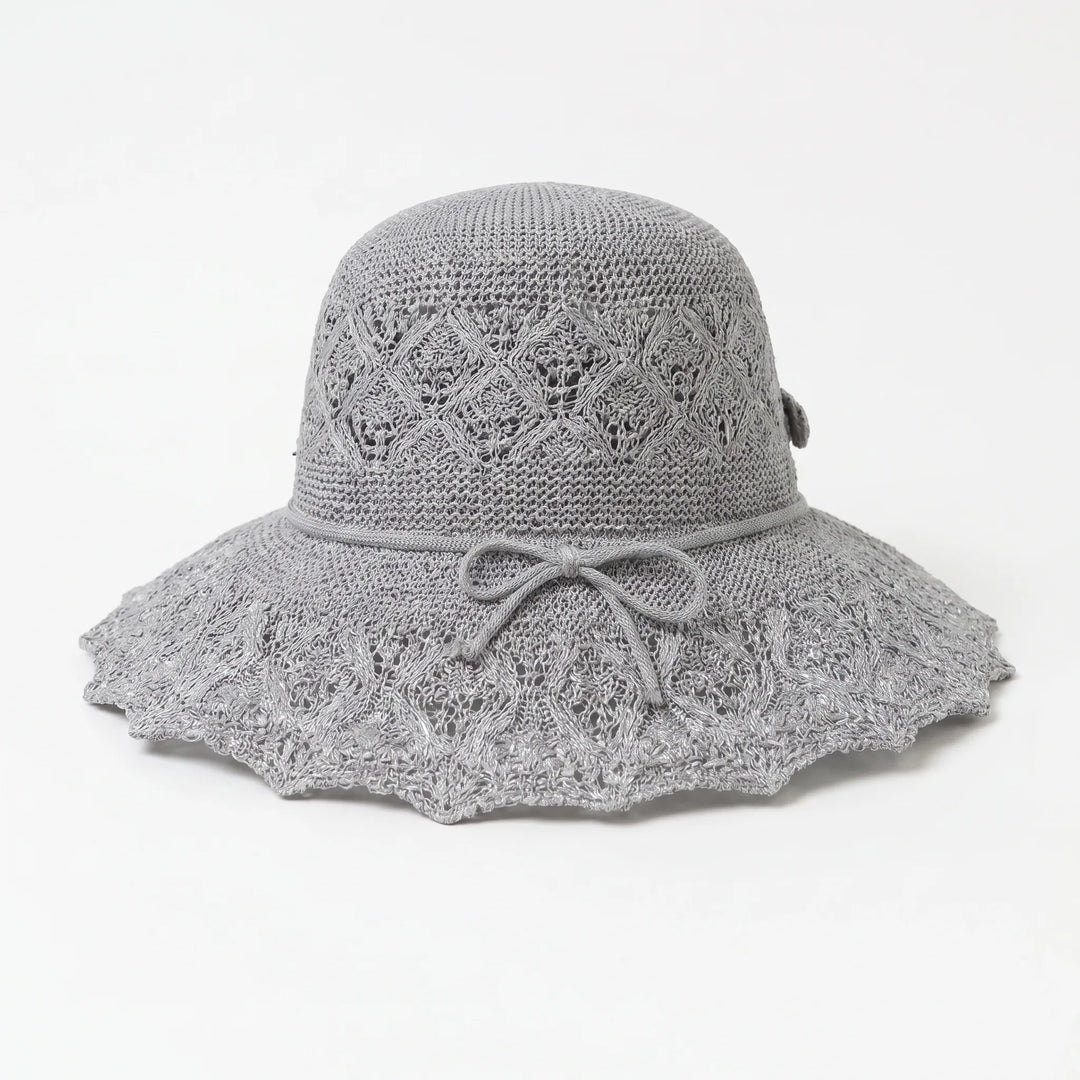 Gray women's wide brim sun hat. Breathable, packable, and stylish for summer beach days or outdoor travel.