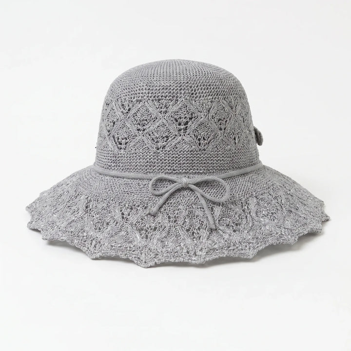Gray women's wide brim sun hat. Breathable, packable, and stylish for summer beach days or outdoor travel.