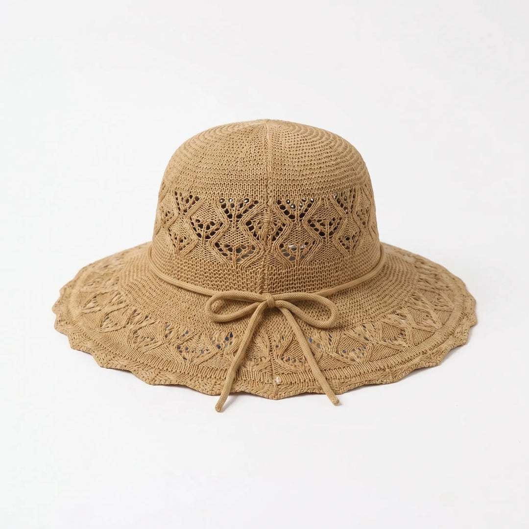 Stylish women's wide brim sun hat. Breathable fabric & packable design offer comfort for summer outdoor wear.
