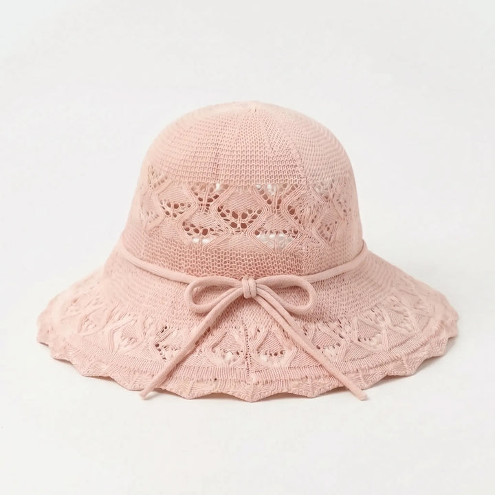 Pink women's wide brim sun hat. Breathable, packable, and fashionable for summer beach days and travel.