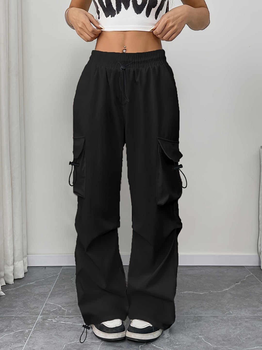 Relaxed fit women's wide leg cargo pants featuring a comfortable drawstring waist and practical pockets.