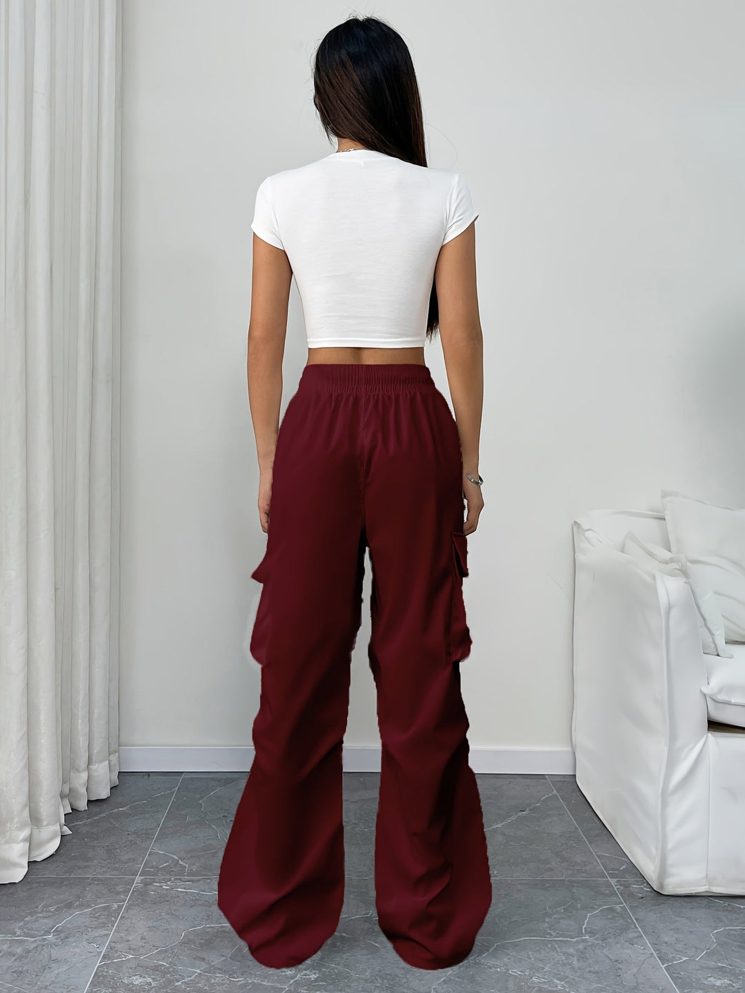 Comfortable women's wide leg cargo pants with a drawstring waist, great for versatile streetwear looks.