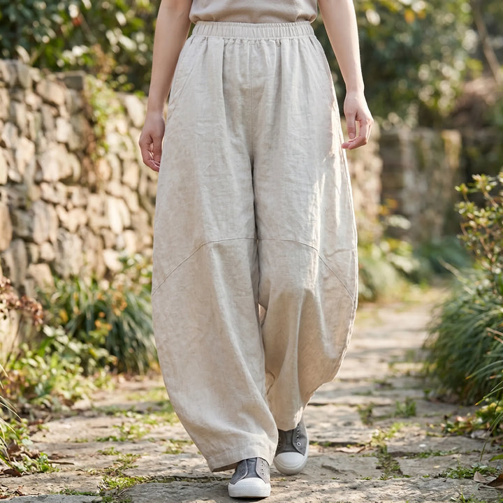 Women's wide-leg flowy comfort pants with elastic waist. Ideal loose-fit trousers for casual wear & summer fashion.