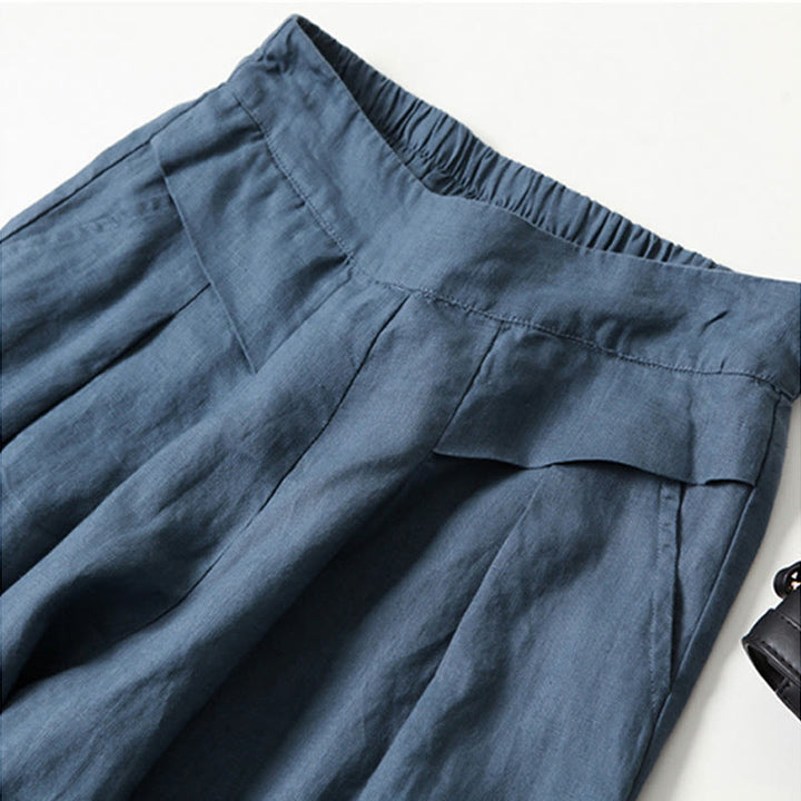Side view of women's wide-leg trousers, black, emphasizing comfortable and casual style.