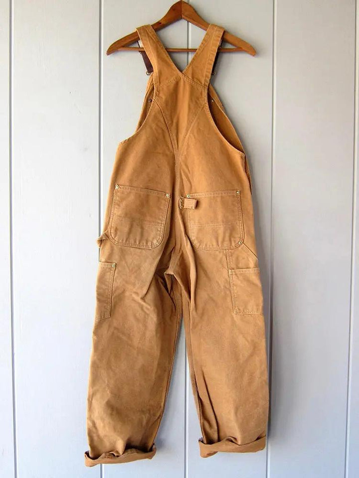 Comfortable women's utility-style wide-leg overalls. Relaxed fit jumpsuit for versatile casual wear.