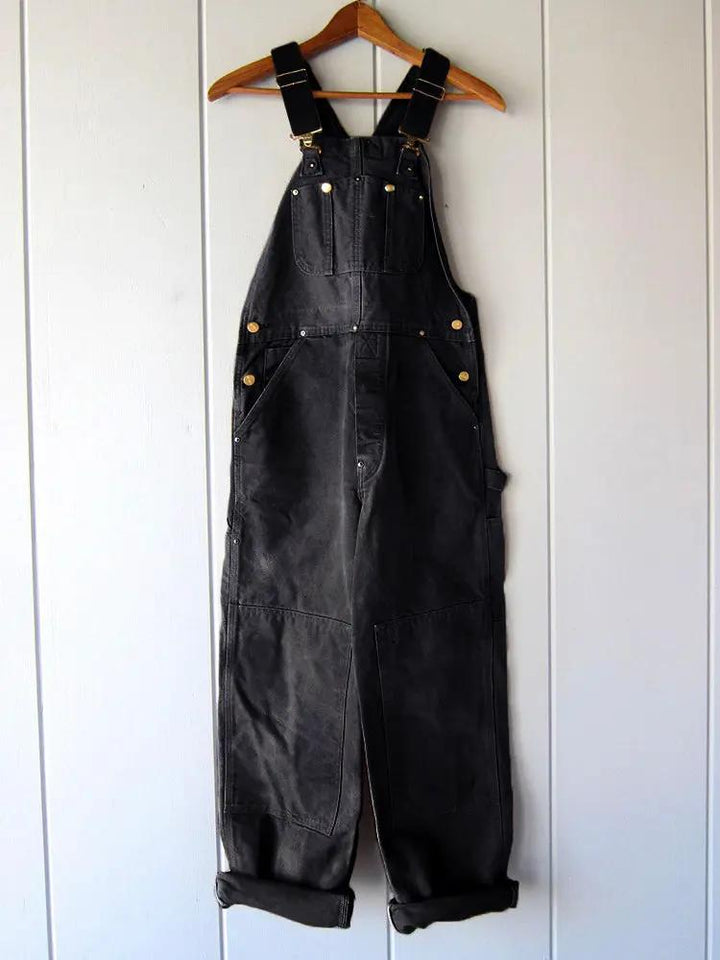 Women's relaxed fit wide-leg jumpsuit overalls. Comfortable, casual utility style for versatile fashion.