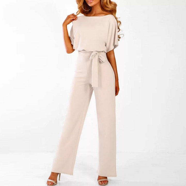 Women's wide-leg jumpsuit with belted waist. Versatile one-piece for elegant day-to-night chic style.
