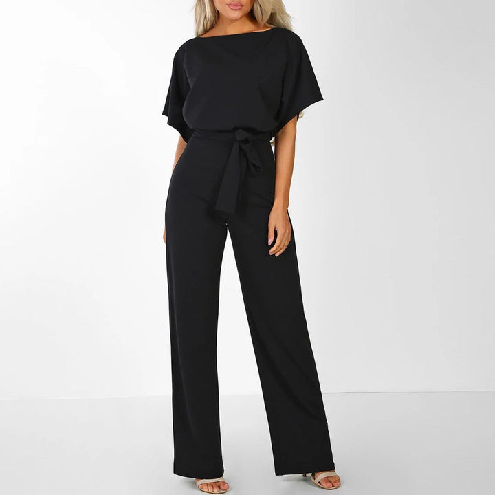 Solid color women's wide-leg jumpsuit, belted for a flattering fit. Perfect for summer casual or evening wear.