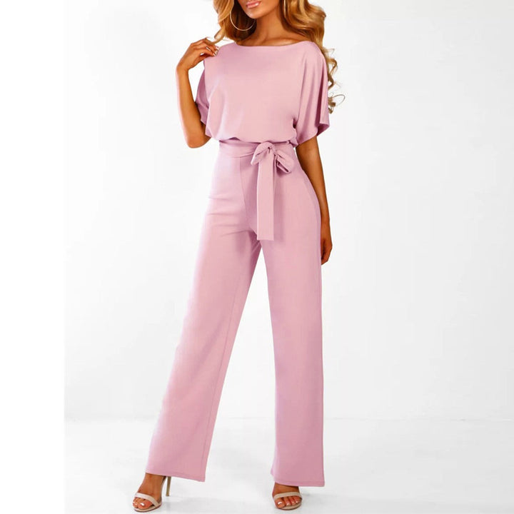 Fashionable women's wide-leg jumpsuit with a belted waist. Elegant one-piece outfit for versatile styling.