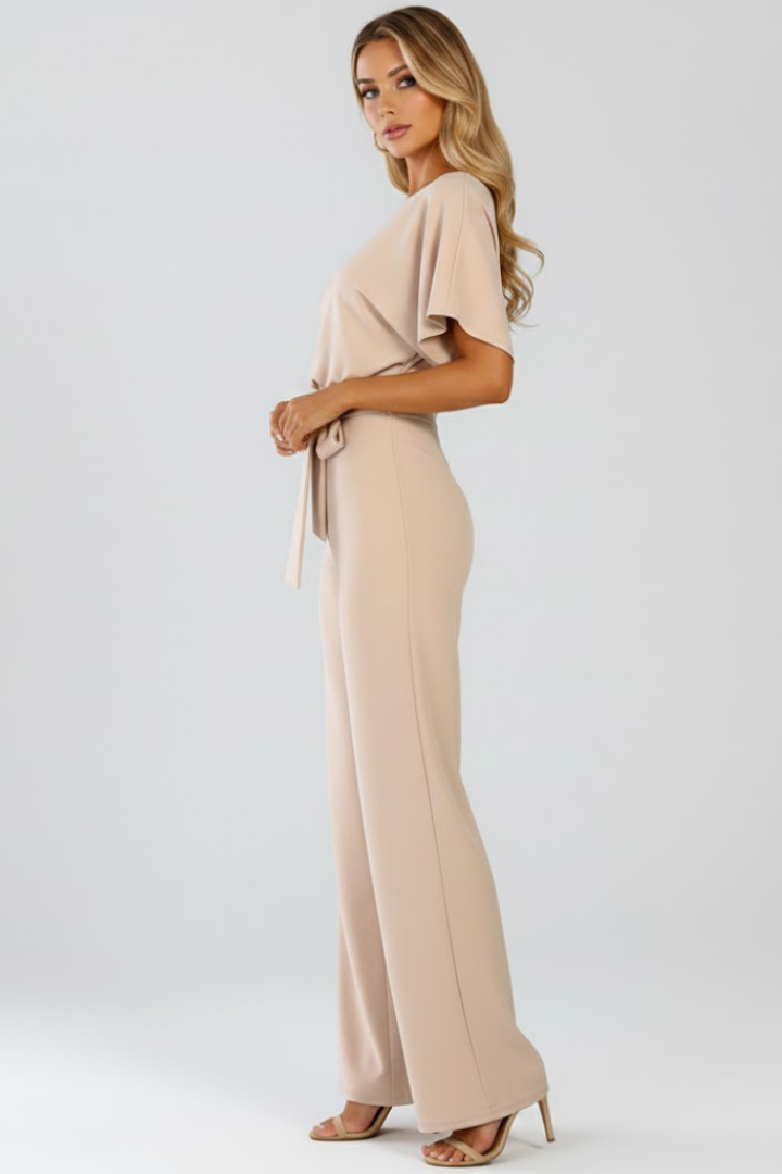 Black women's wide leg short sleeve jumpsuit with belt. A versatile, elegant one-piece for casual or evening wear.